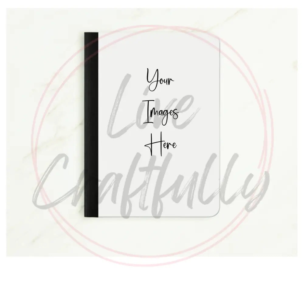 White notebook with black binding on a white background