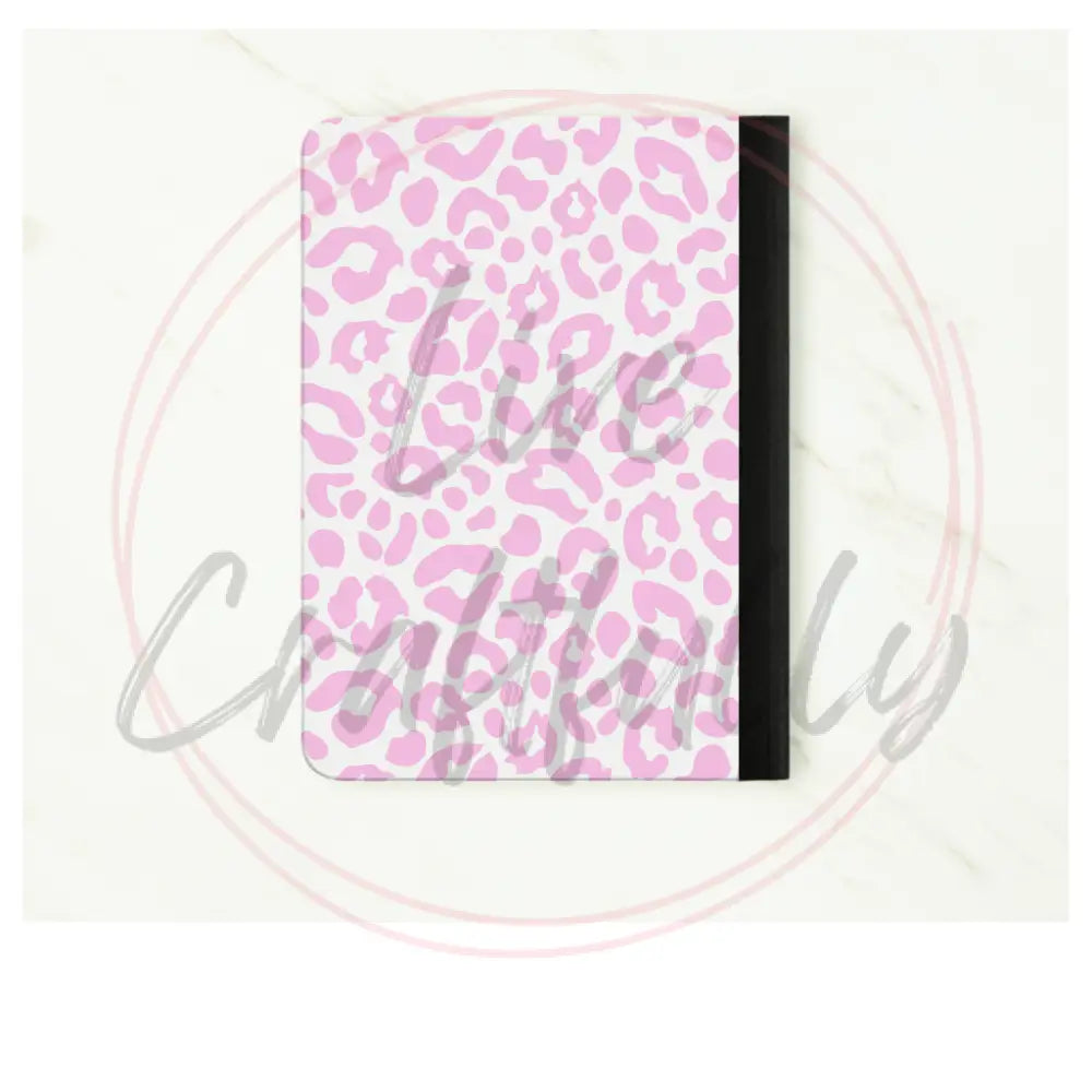 Notebook with pink leopard print cover on a white background