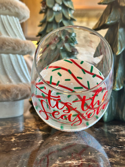 Decorative glass plates with festive designs on a wooden surface.